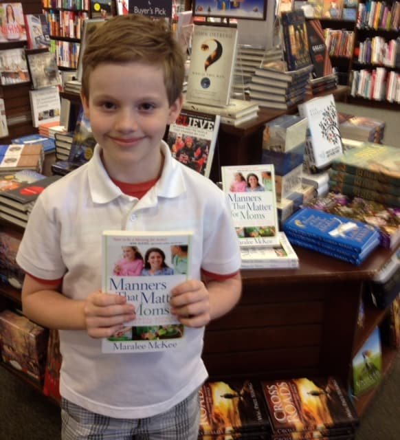 Corbett Holding Manners That Matter for Moms the Day the Book Debuted